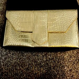 Gold clutch never used